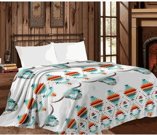 Mia Throw Blanket - White Buffalo Queen size on bed in cozy room.