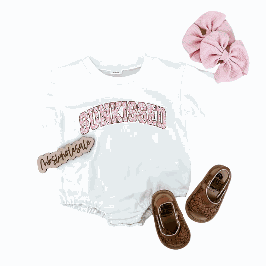 Suns Out Bubble Suit with accessories including pink hair bow and brown shoes.