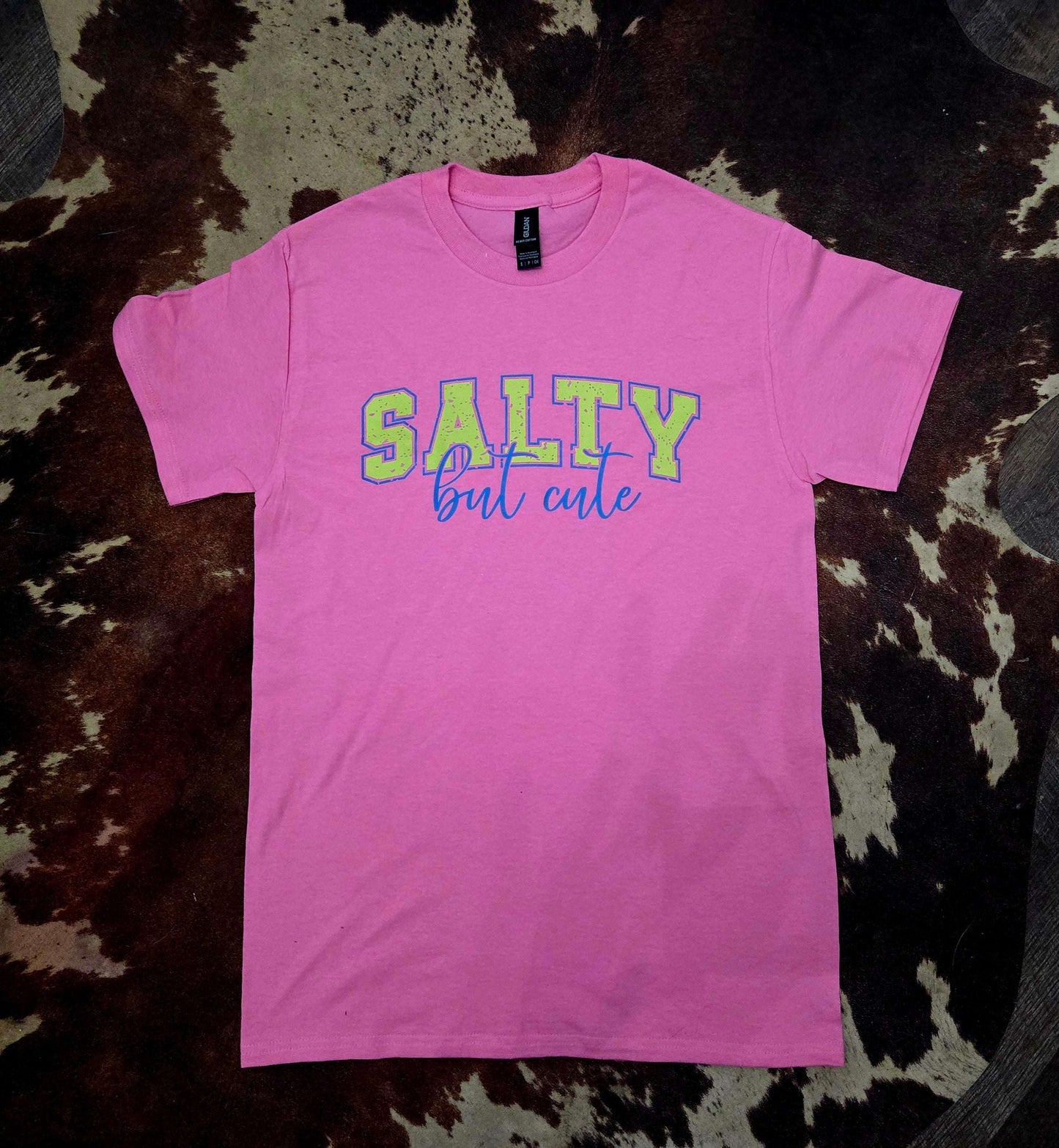 Bright pink Salty But Cute graphic tee capturing playful coastal beach vibes