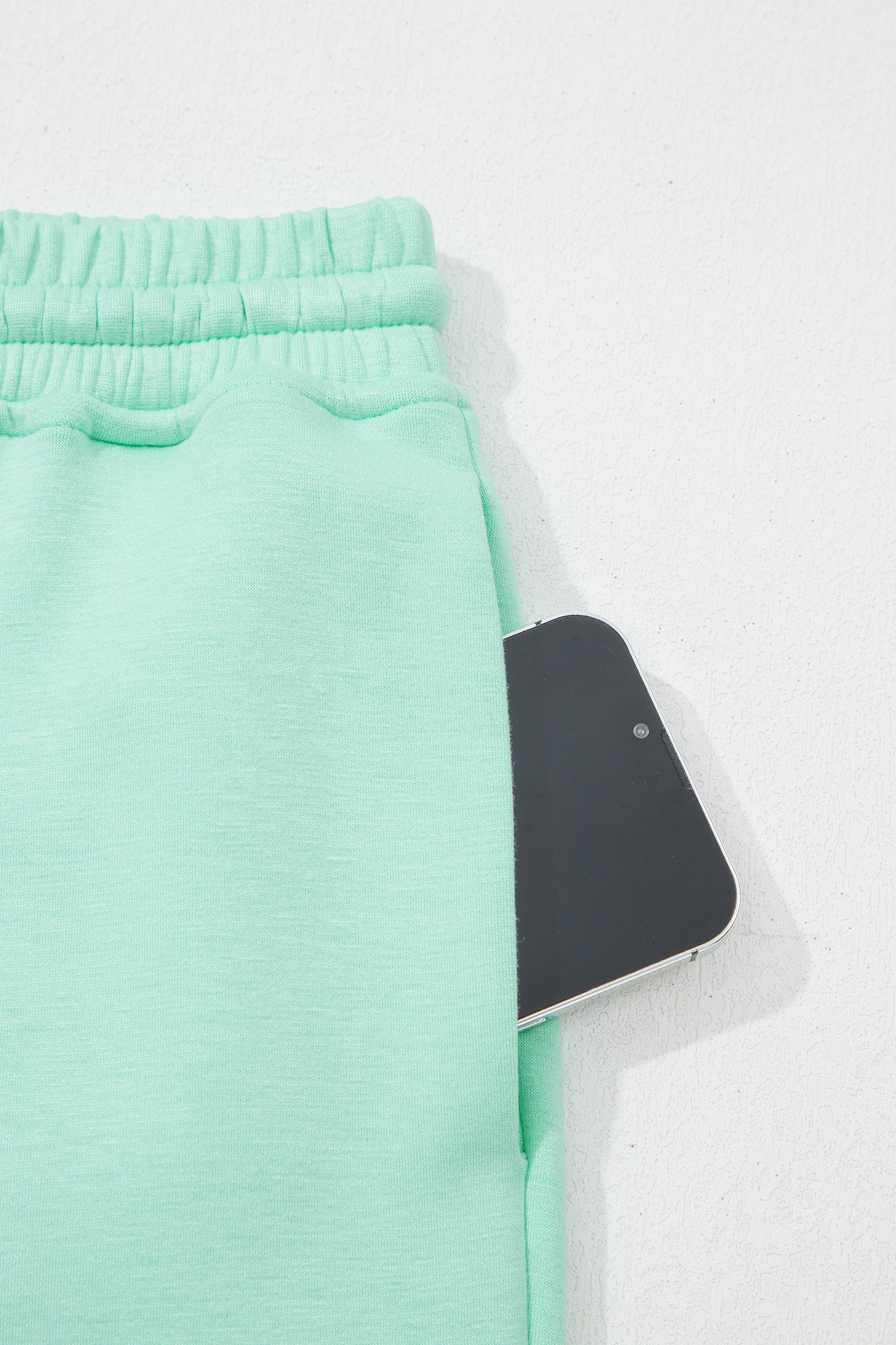 Moonlight jade two piece set - close-up of pants waistband and front seam detail showing fabric texture