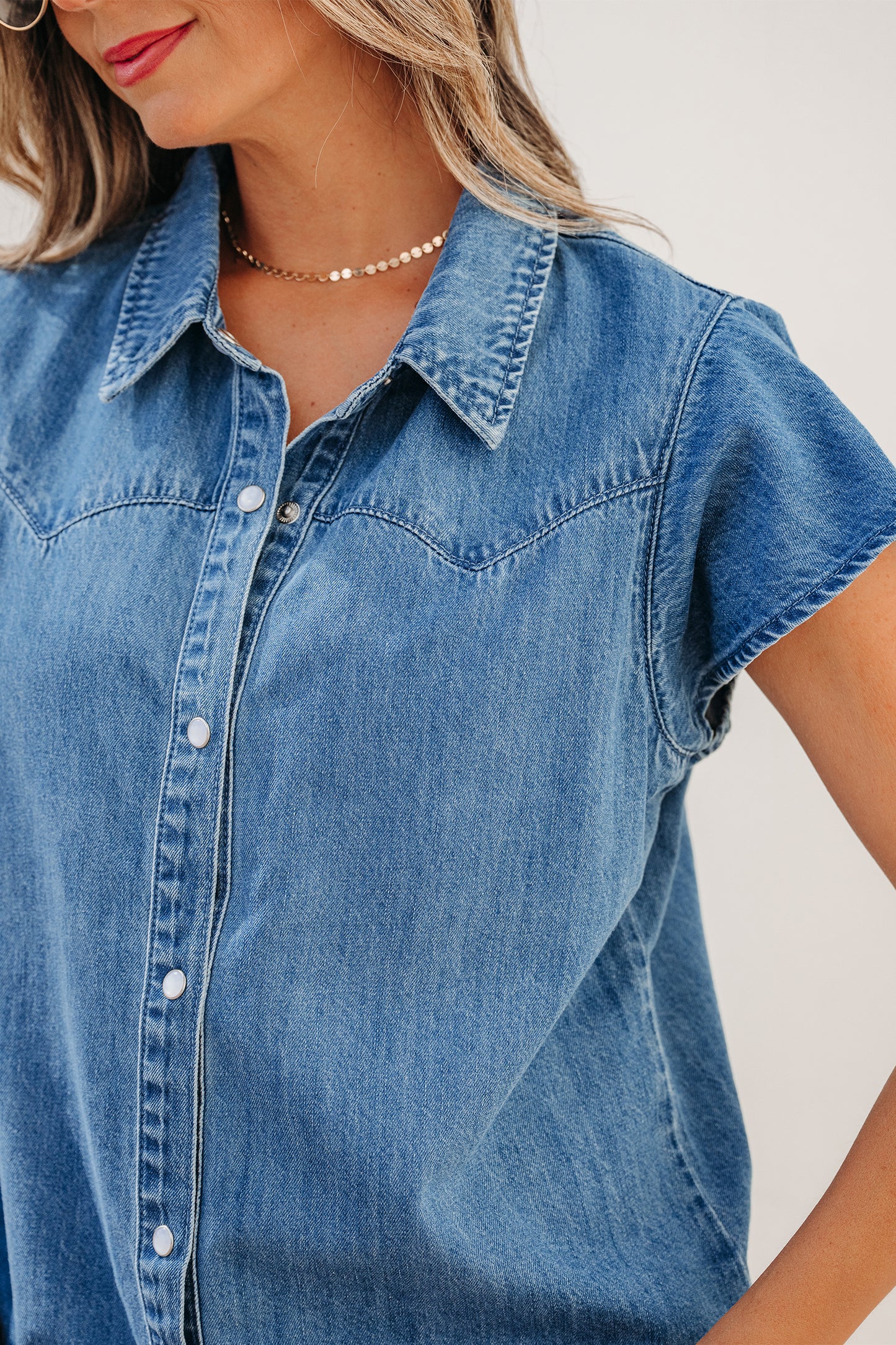Dusk blue ruffle sleeve denim shirt - lifestyle shot on model showing full Western-inspired styling