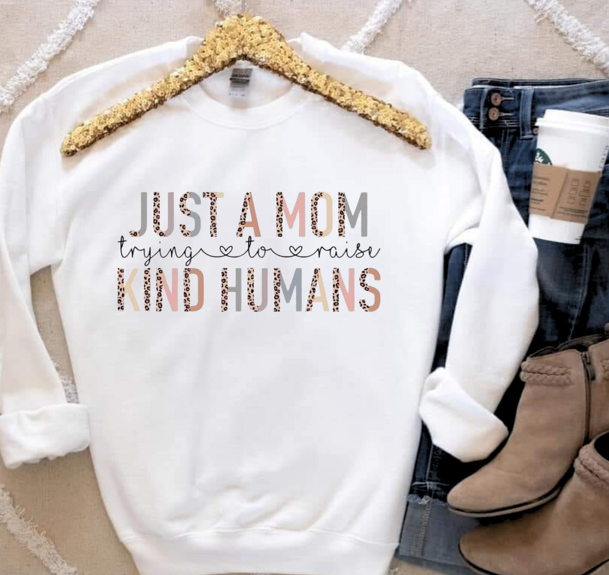Mom Raising Kind Humans t-shirt promoting compassion and positivity.