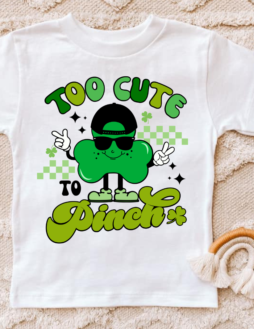 Too Cute To Pinch T-shirt with playful design and humorous text.