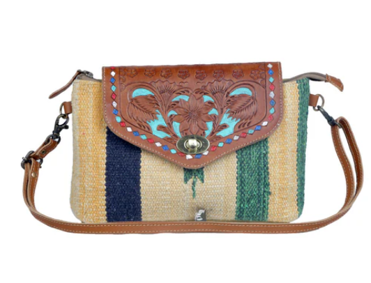 MYRA-Beamy Rays Hand-Tooled Bag with embossed leather flap and vibrant recycled rug design.