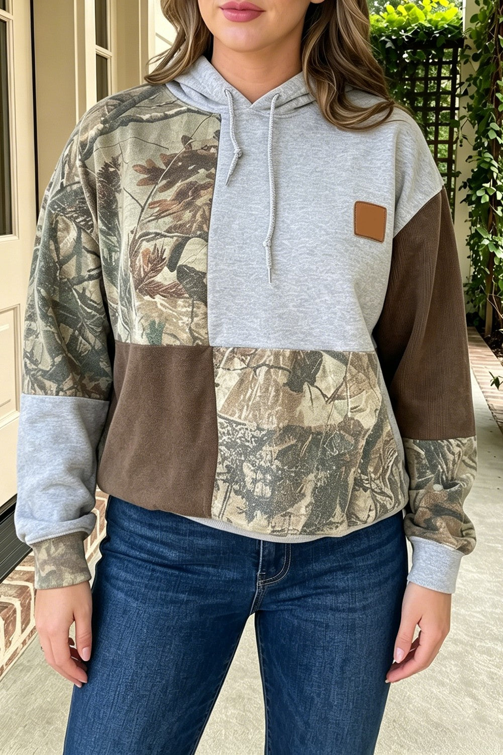 Camo Color Block Patchwork Hoodie - model front close-up showing leather patch and camo detail