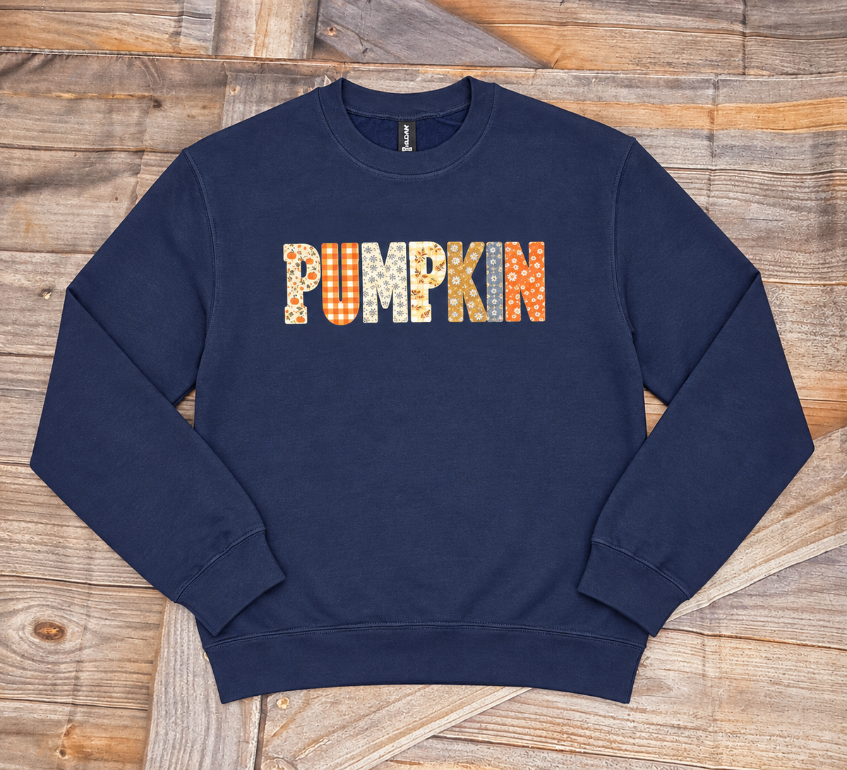 Navy graphic sweatshirt with patchwork PUMPKIN design on the chest