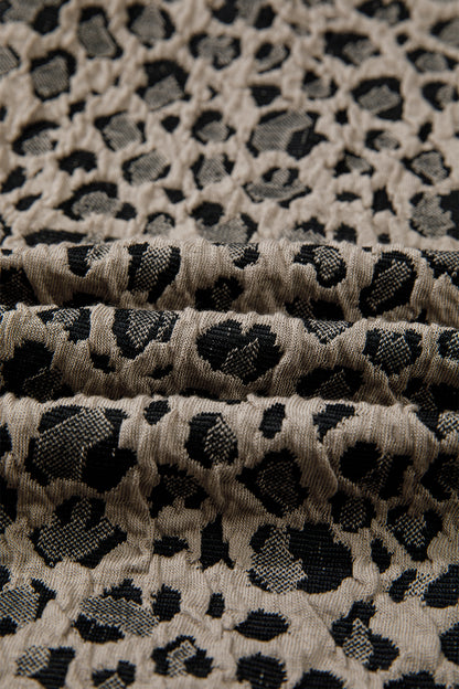 Beige leopard jacquard knit zip collar top - lifestyle shot on model showing elevated sporty-chic styling