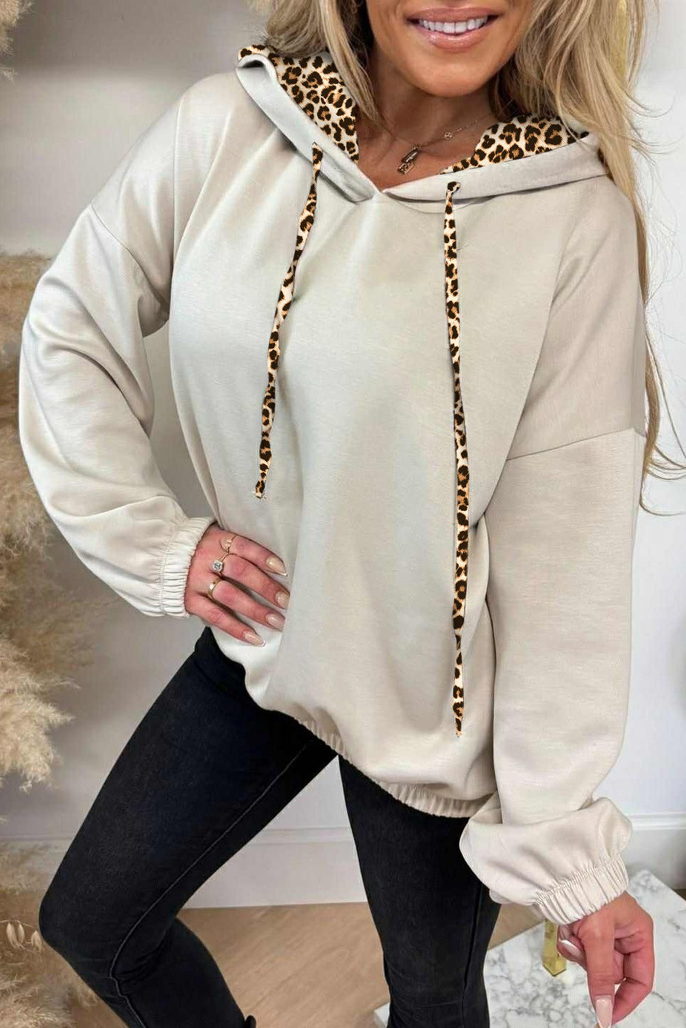 Cream leopard contrast hoodie styled on a model