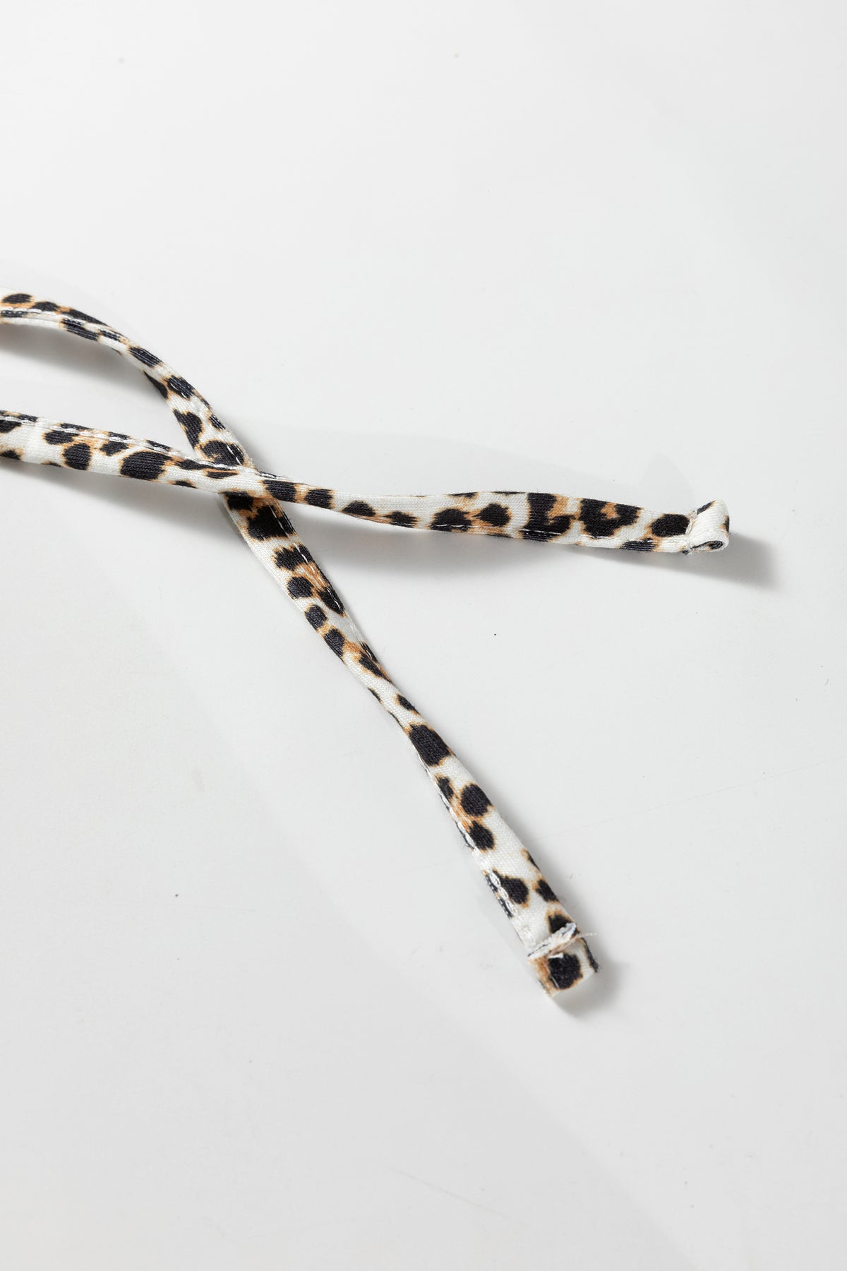 Front view of cream leopard drawstring hoodie
