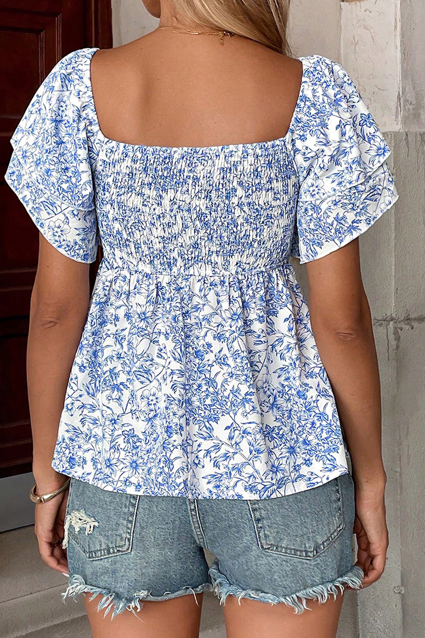 Blue toile floral smocked babydoll blouse - back on model