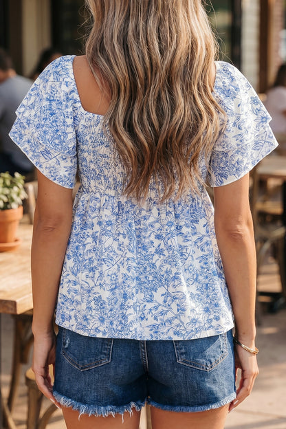 Blue toile floral smocked babydoll blouse - front detail on model