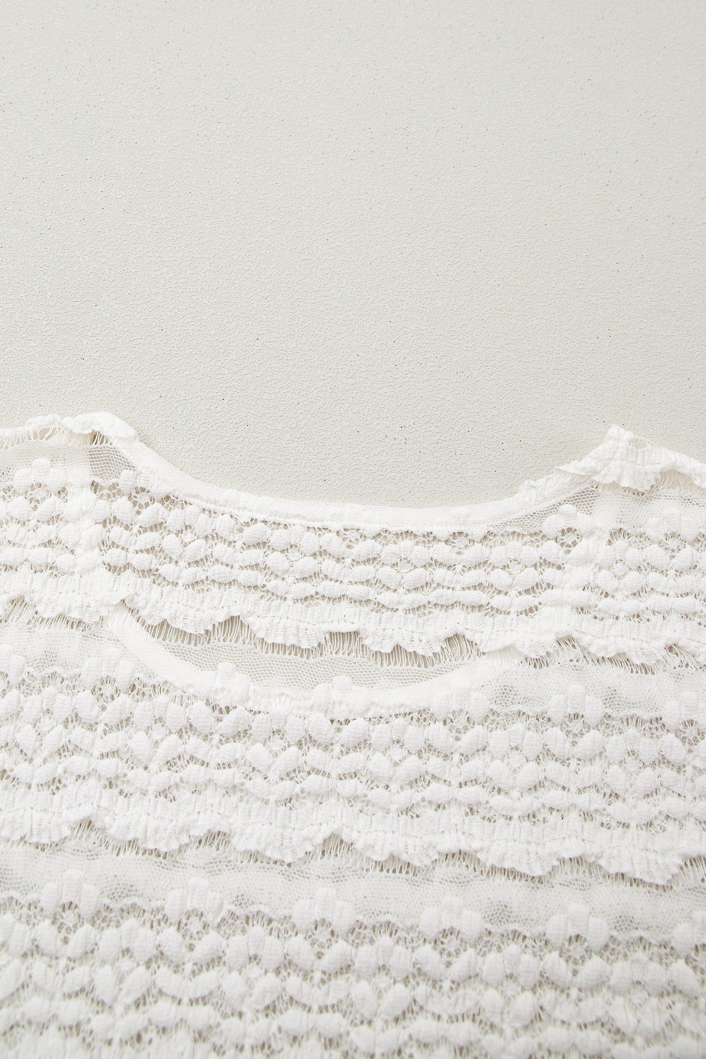 White sheer lace short sleeve top - front view on model close up