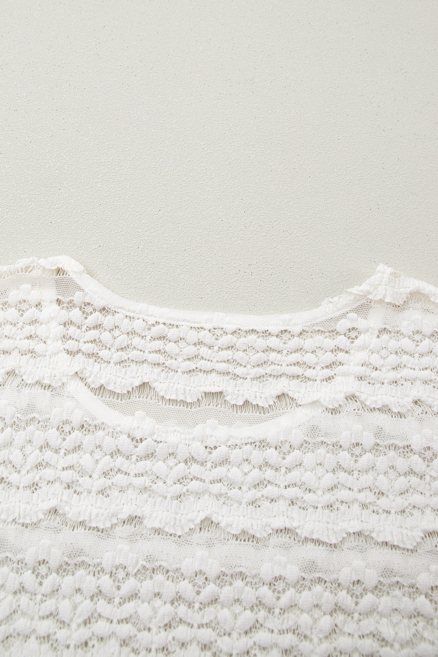 White sheer lace short sleeve top - front view on model close up