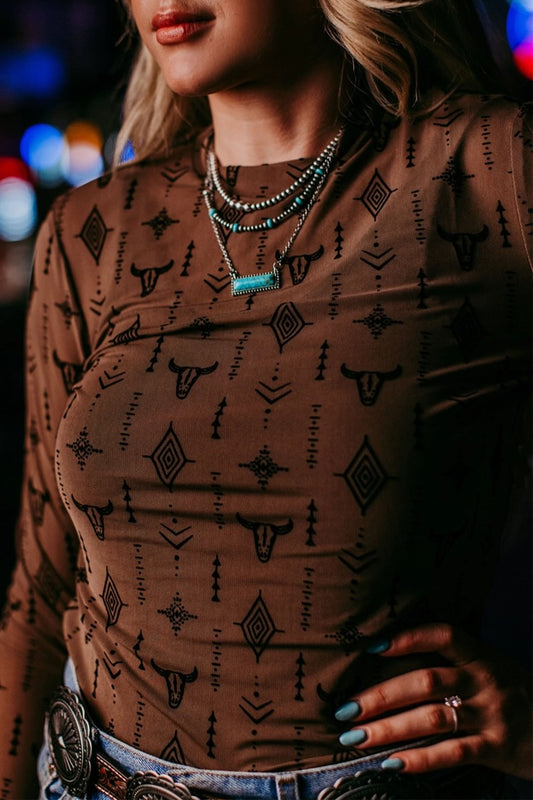 Chestnut western print mesh top styled with denim and western accessories