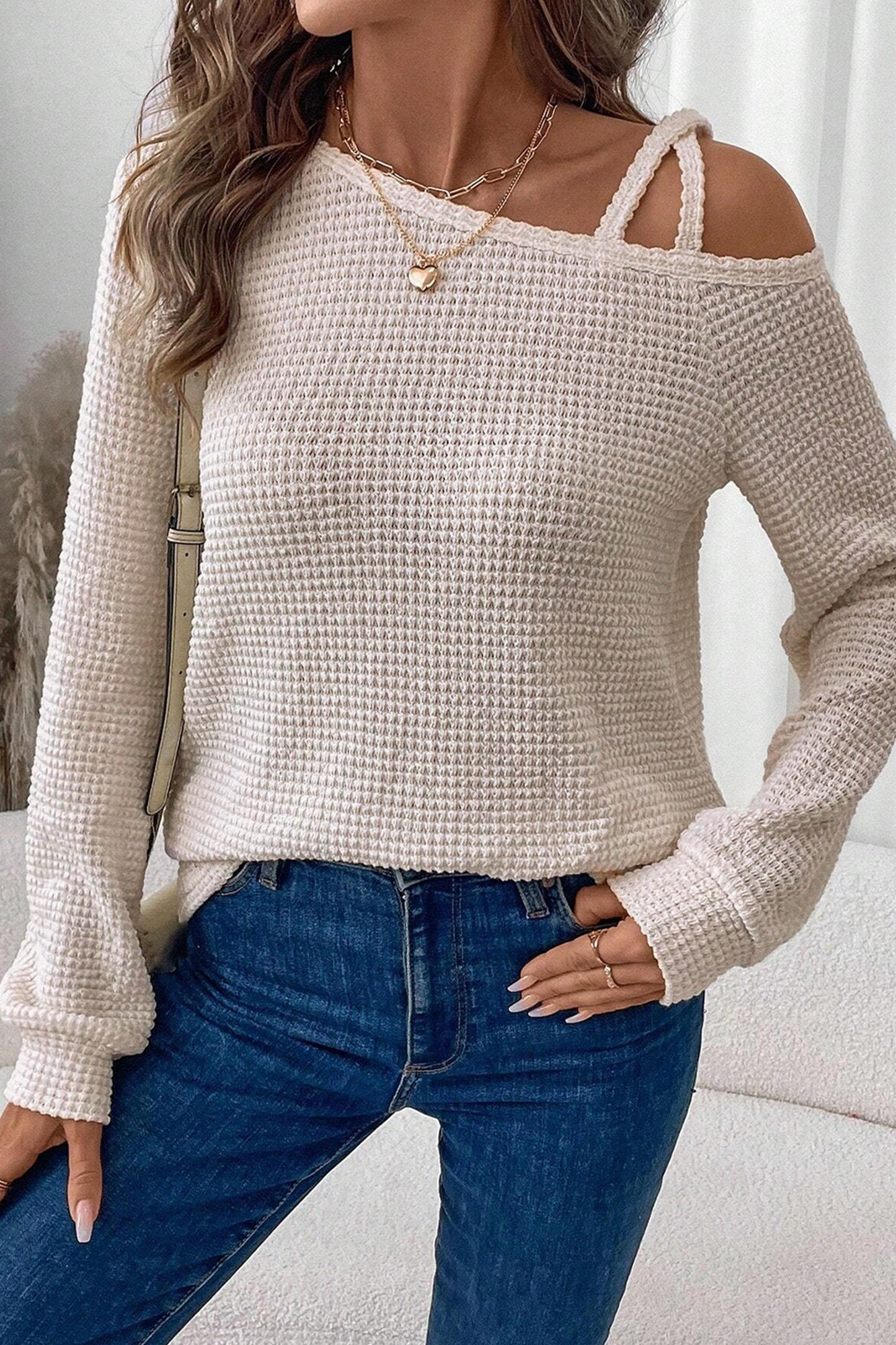 Cream waffle knit cold shoulder top - close-up of ribbed cuff detail showing waffle knit texture