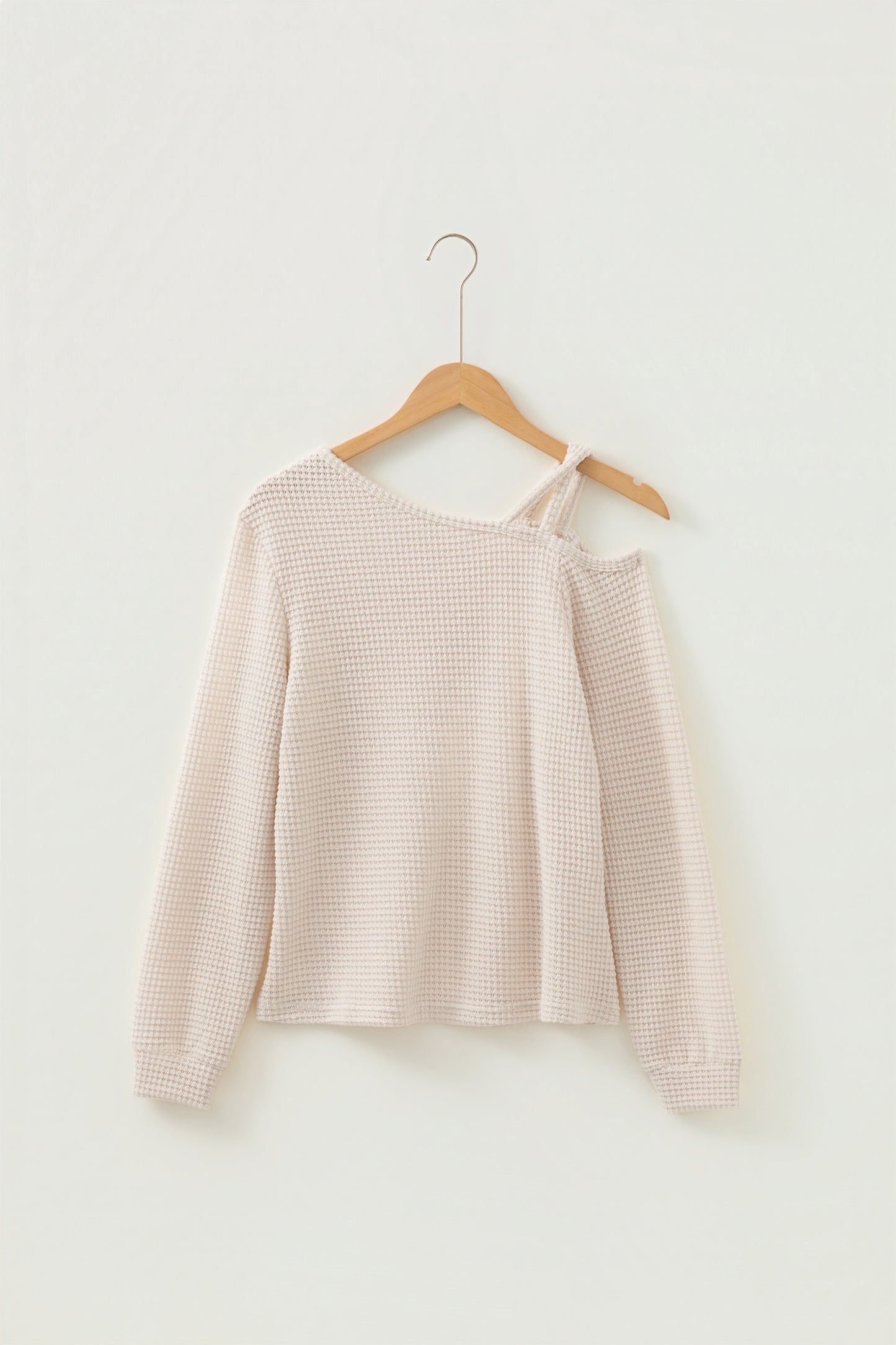 Cream waffle knit cold shoulder top - close-up of self-fabric strap and cold shoulder detail