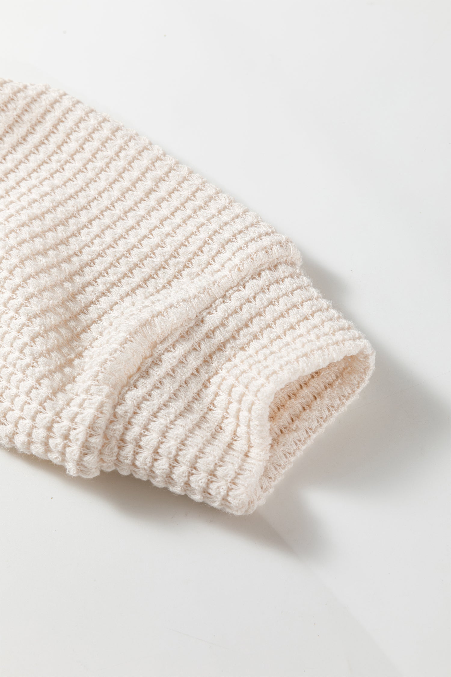 Cream waffle knit cold shoulder top - front on model showing relaxed fit and long sleeve length