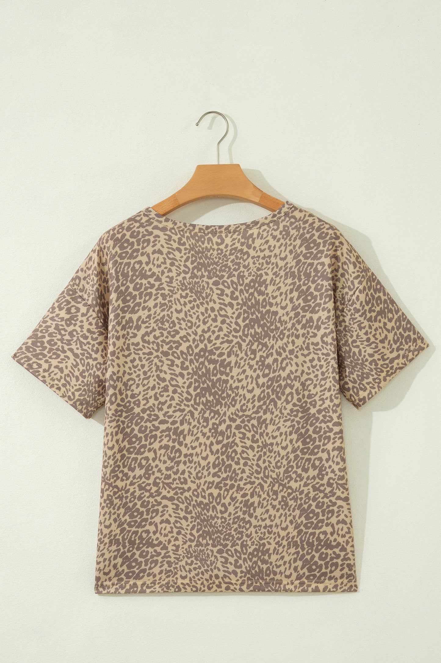 Khaki leopard studded star patch tee - close-up on model showing gold studded star patch detail and suede-look center