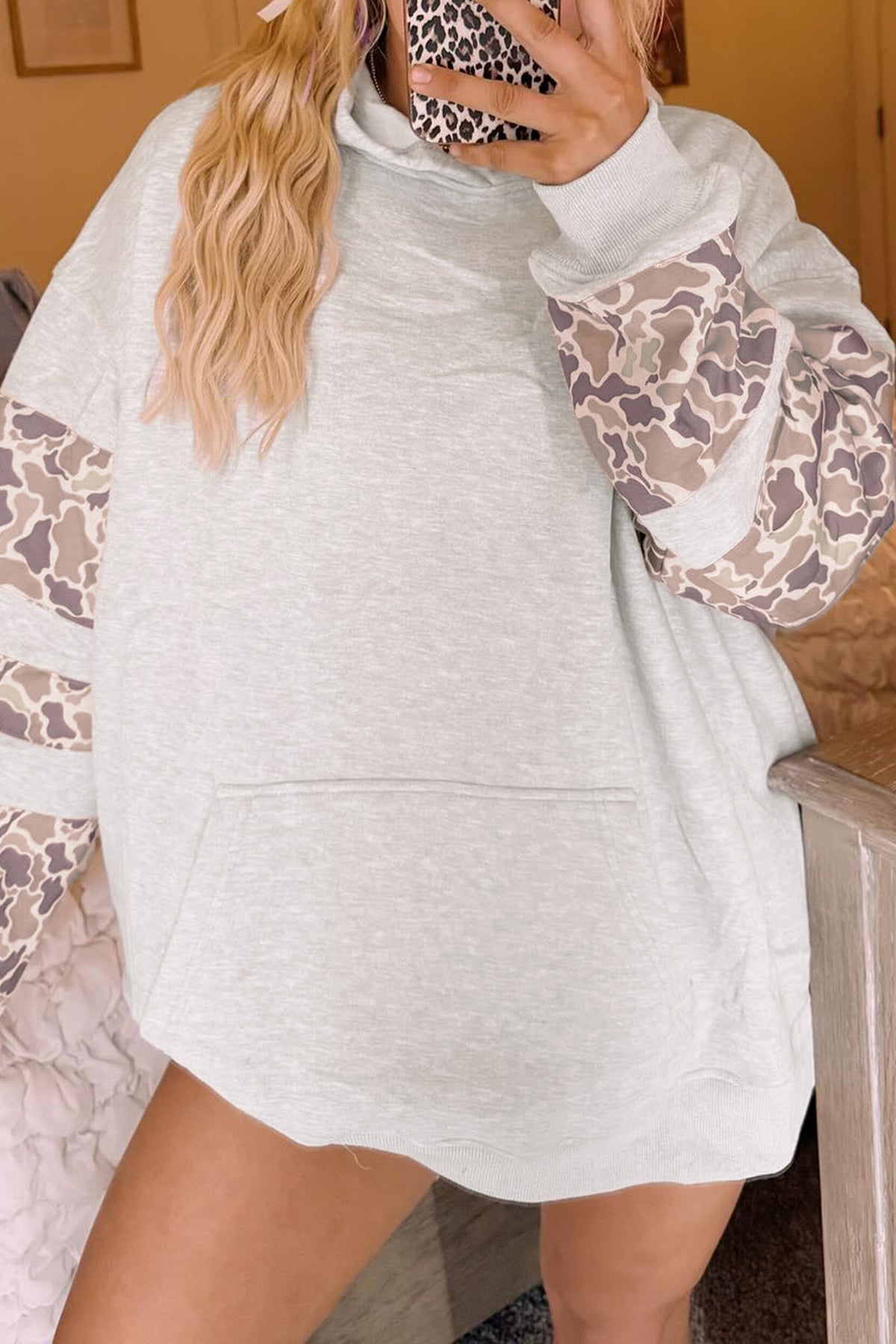 Light gray camo sleeve hoodie styled on a model