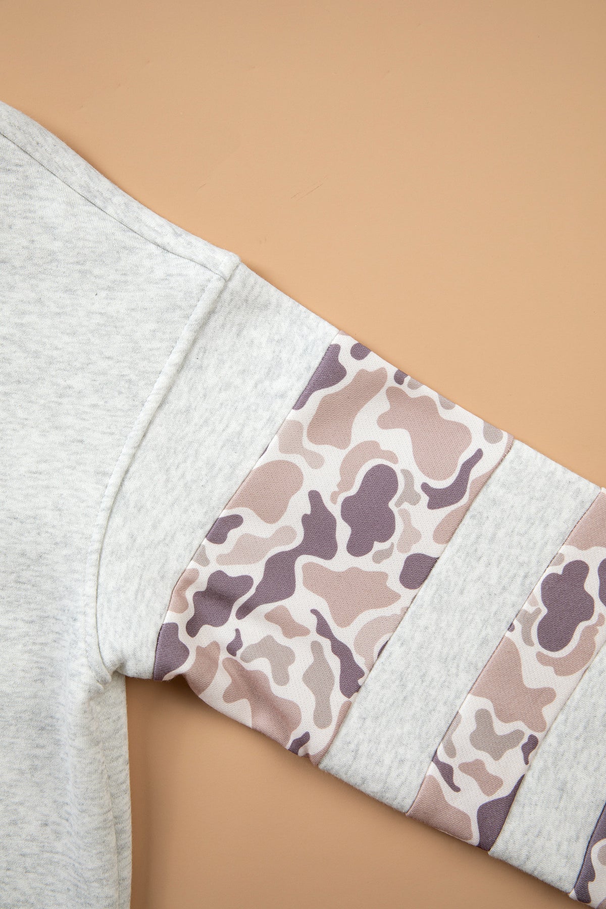 Neutral camo patchwork sleeve detail