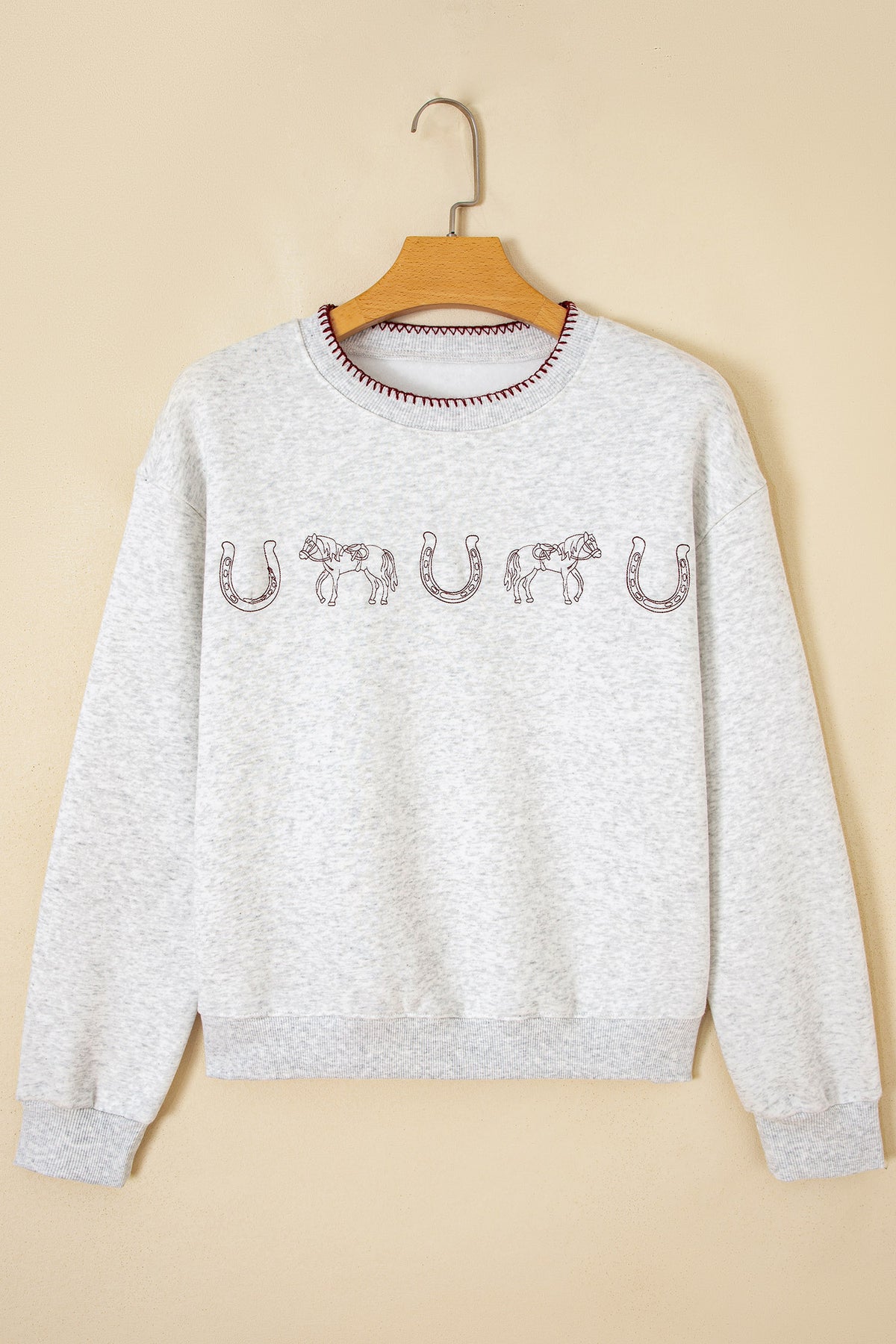 Front view of light gray embroidered western sweatshirt