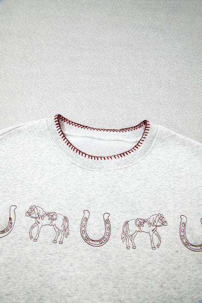 Horse embroidery and contrast neckline stitching detail