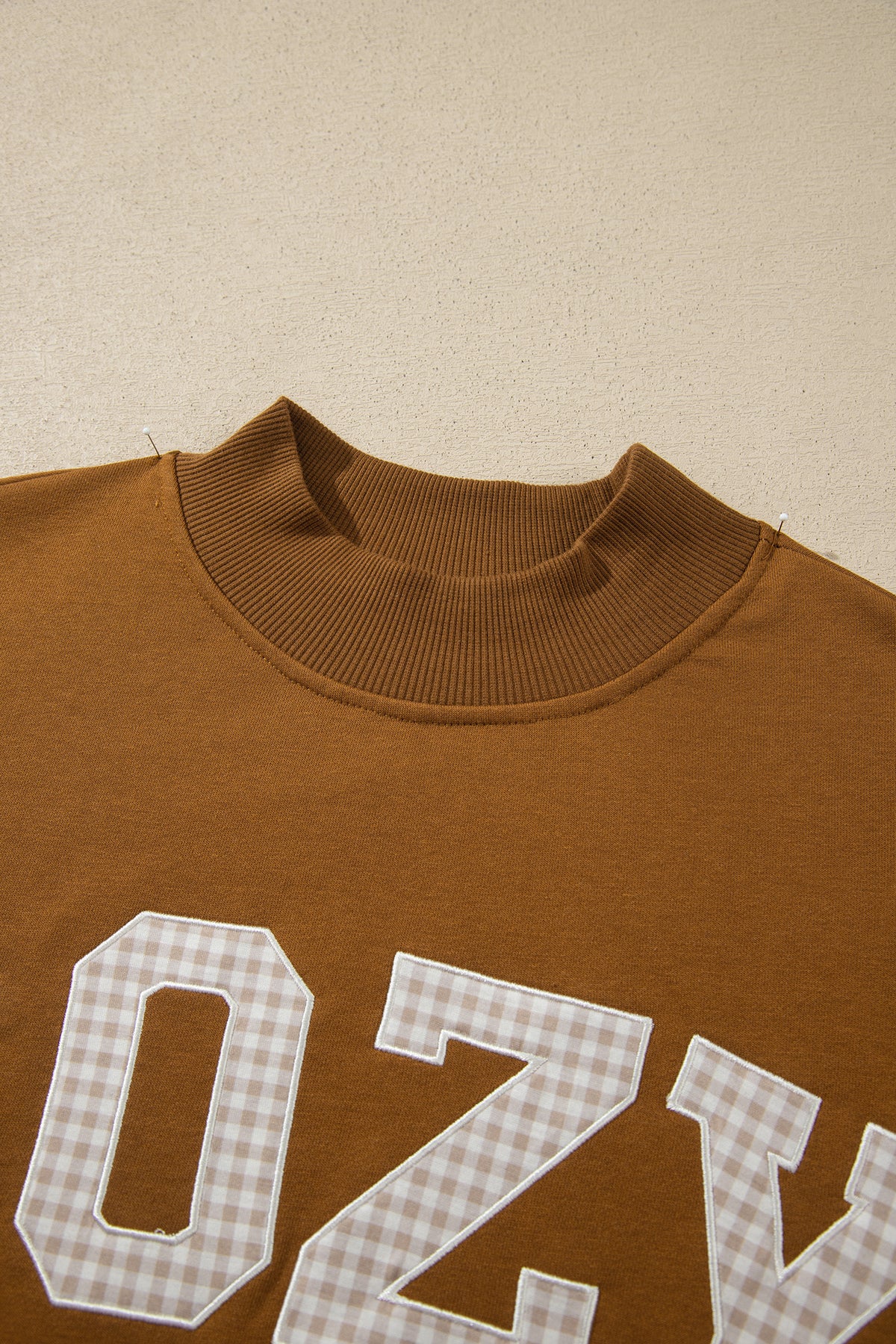 Gingham COZY lettering and stand neckline detail