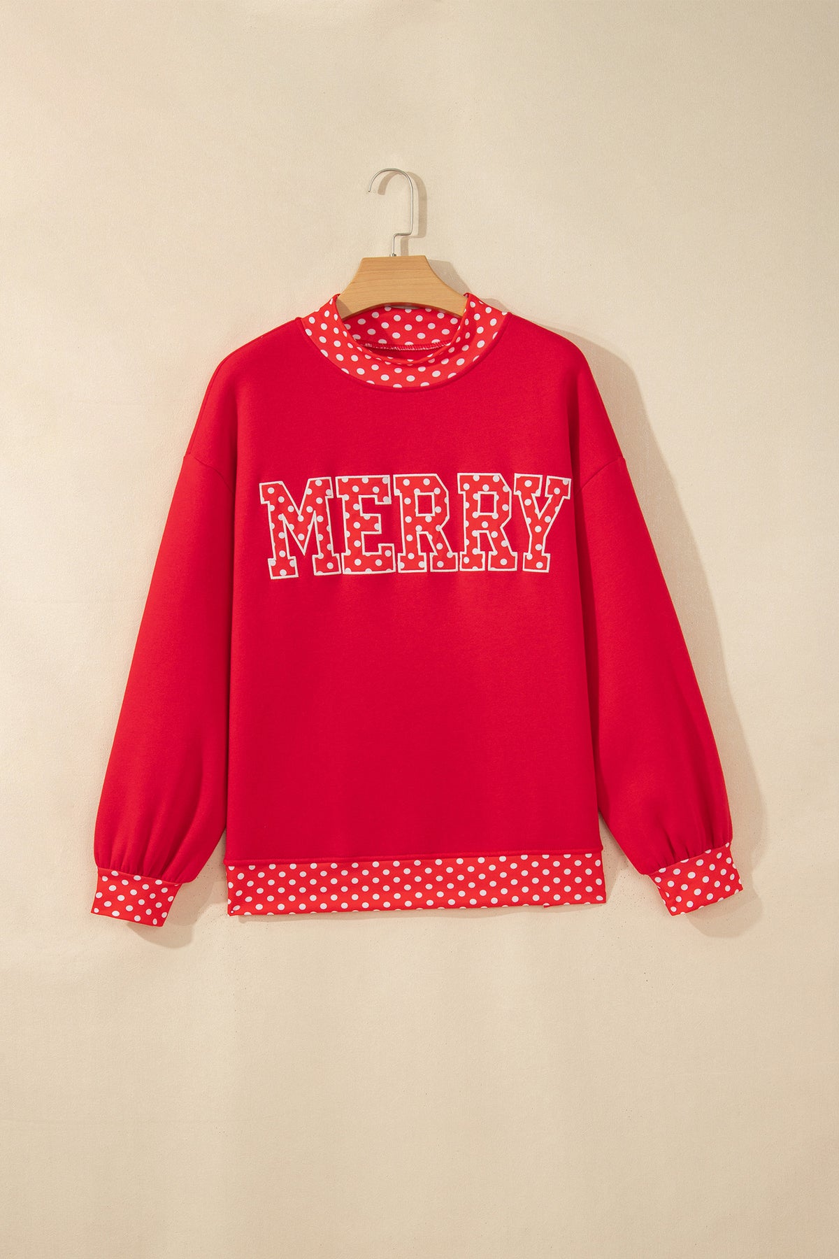 MERRY lettering and polka-dot mock neckline detail