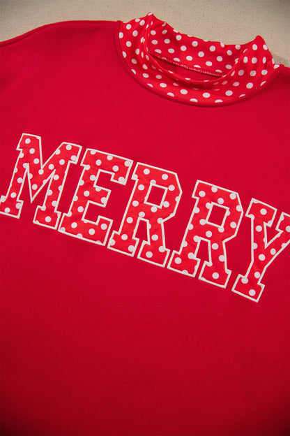 Back view of red sweatshirt with polka-dot trim