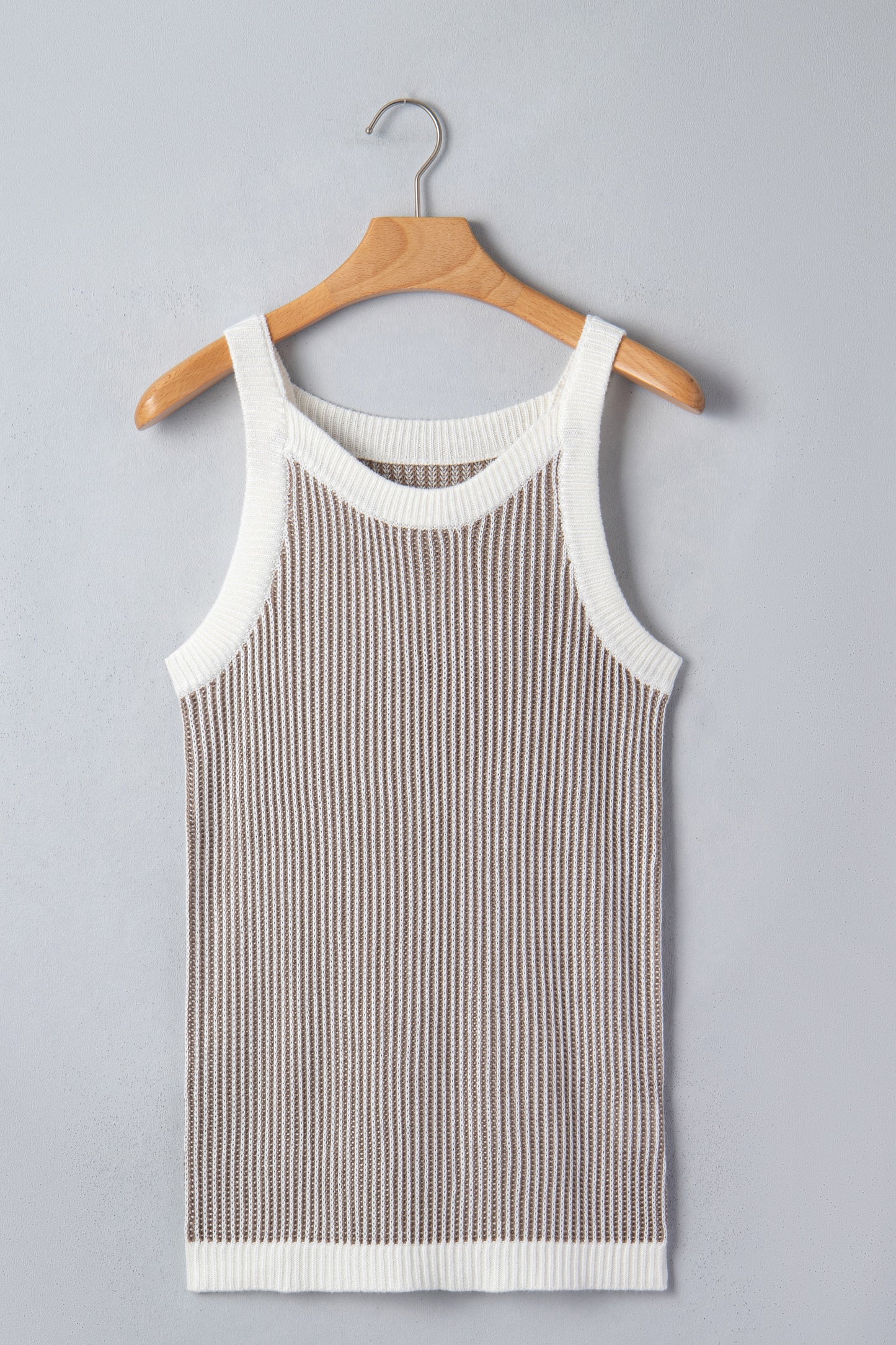 Pale khaki ribbed knit sweater tank - back on model with white pants showing contrast trim at armholes and hem