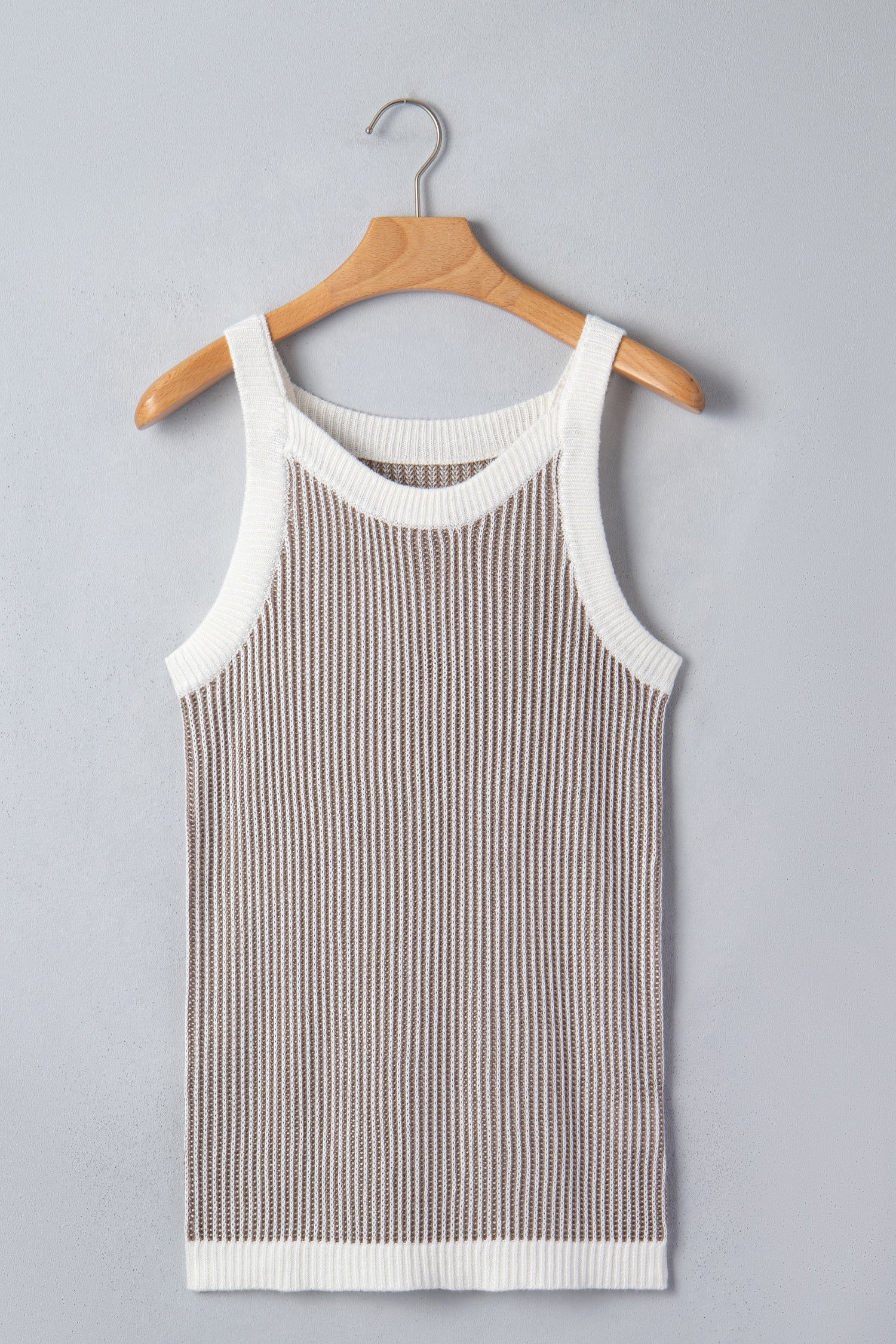 Pale khaki ribbed knit sweater tank - back on model with white pants showing contrast trim at armholes and hem