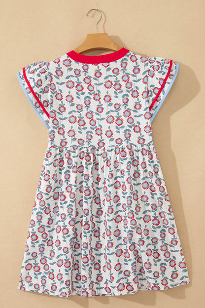 Red floral contrast trim flutter sleeve mini dress - lifestyle shot on model showing full summer styling