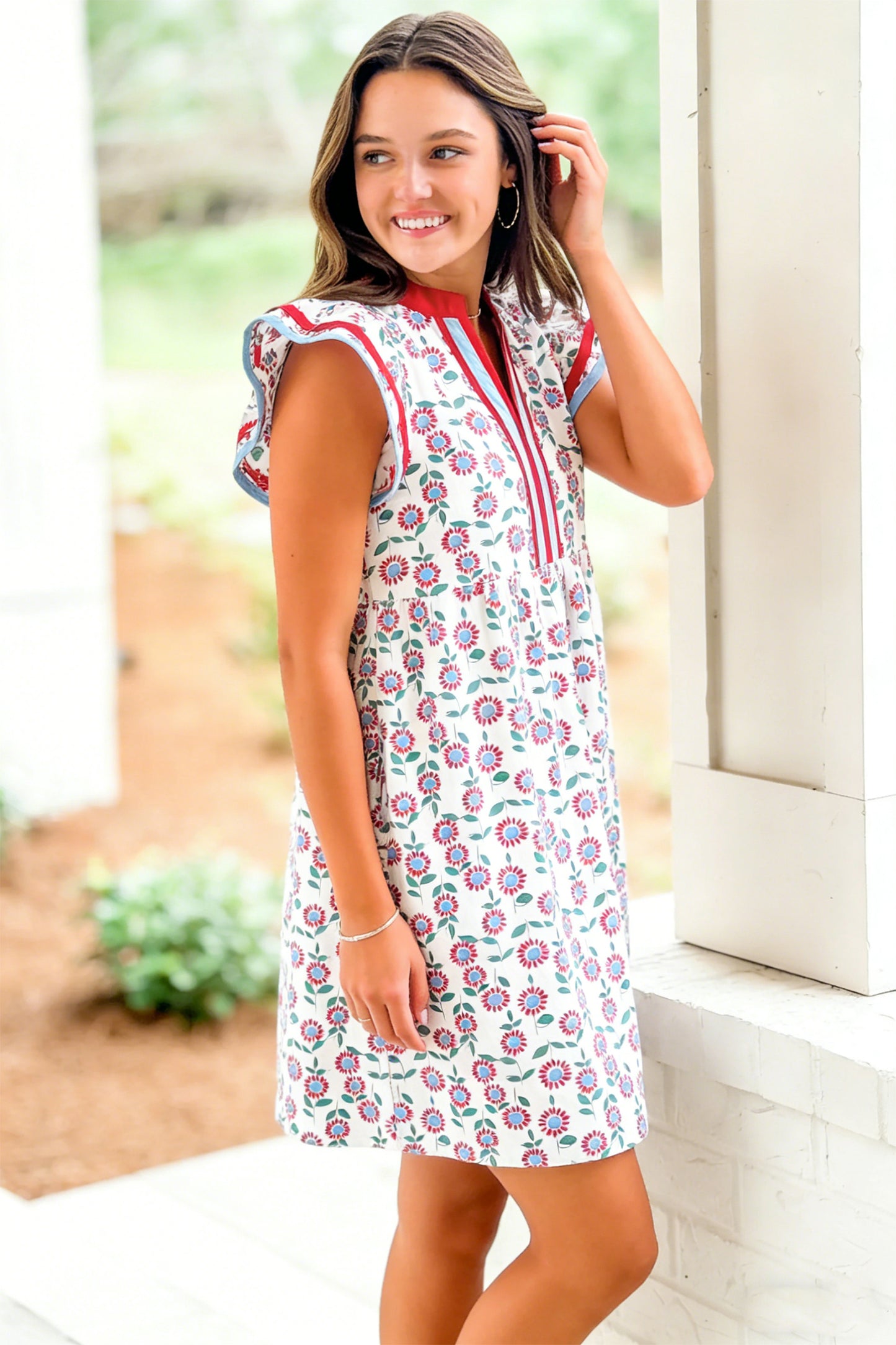 Red floral contrast trim flutter sleeve mini dress - front flat lay on hanger showing full dress and contrast trim detail