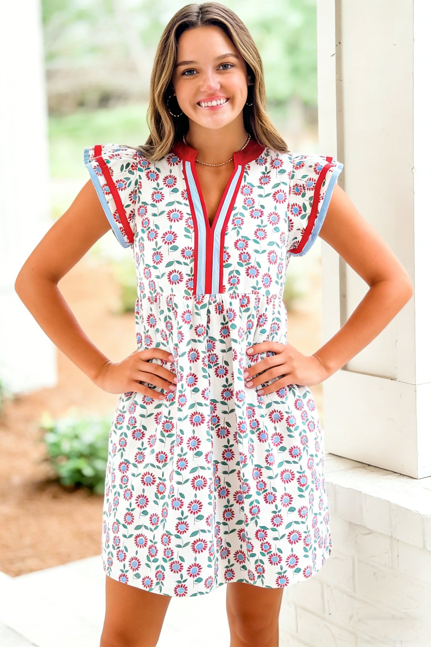 Red floral contrast trim flutter sleeve mini dress - back flat lay on hanger showing flutter sleeves and red collar trim