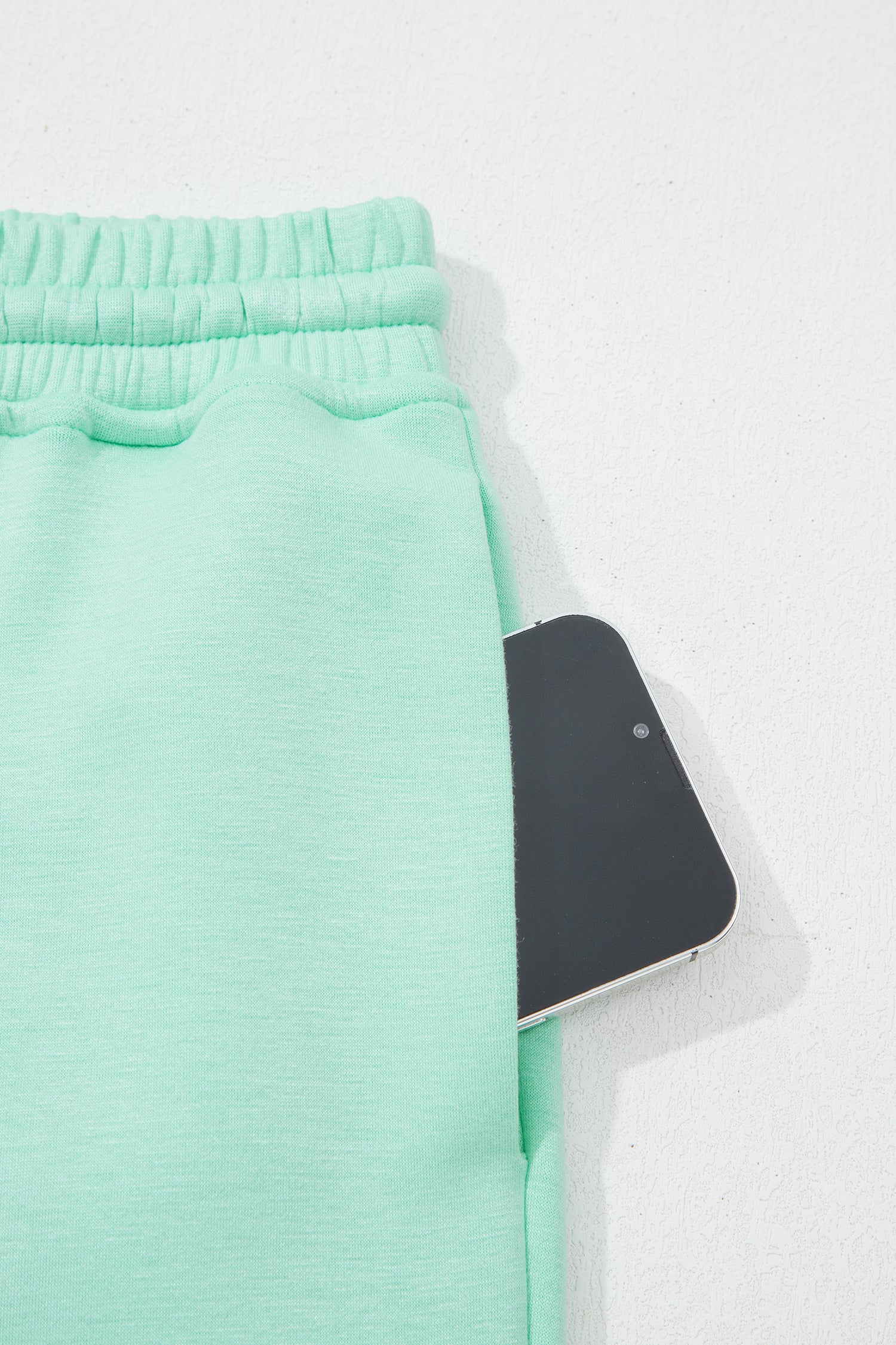 Moonlight jade two piece set - close-up of pants waistband and front seam detail showing fabric texture