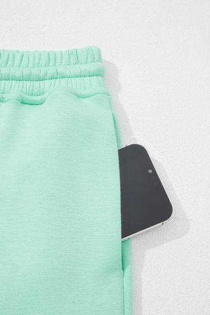 Moonlight jade two piece set - close-up of pants waistband and front seam detail showing fabric texture
