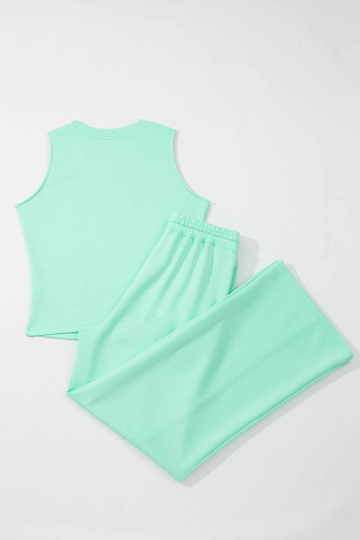 Moonlight jade two piece set - close-up of elastic waistband with drawstring tie and deep side pocket with phone