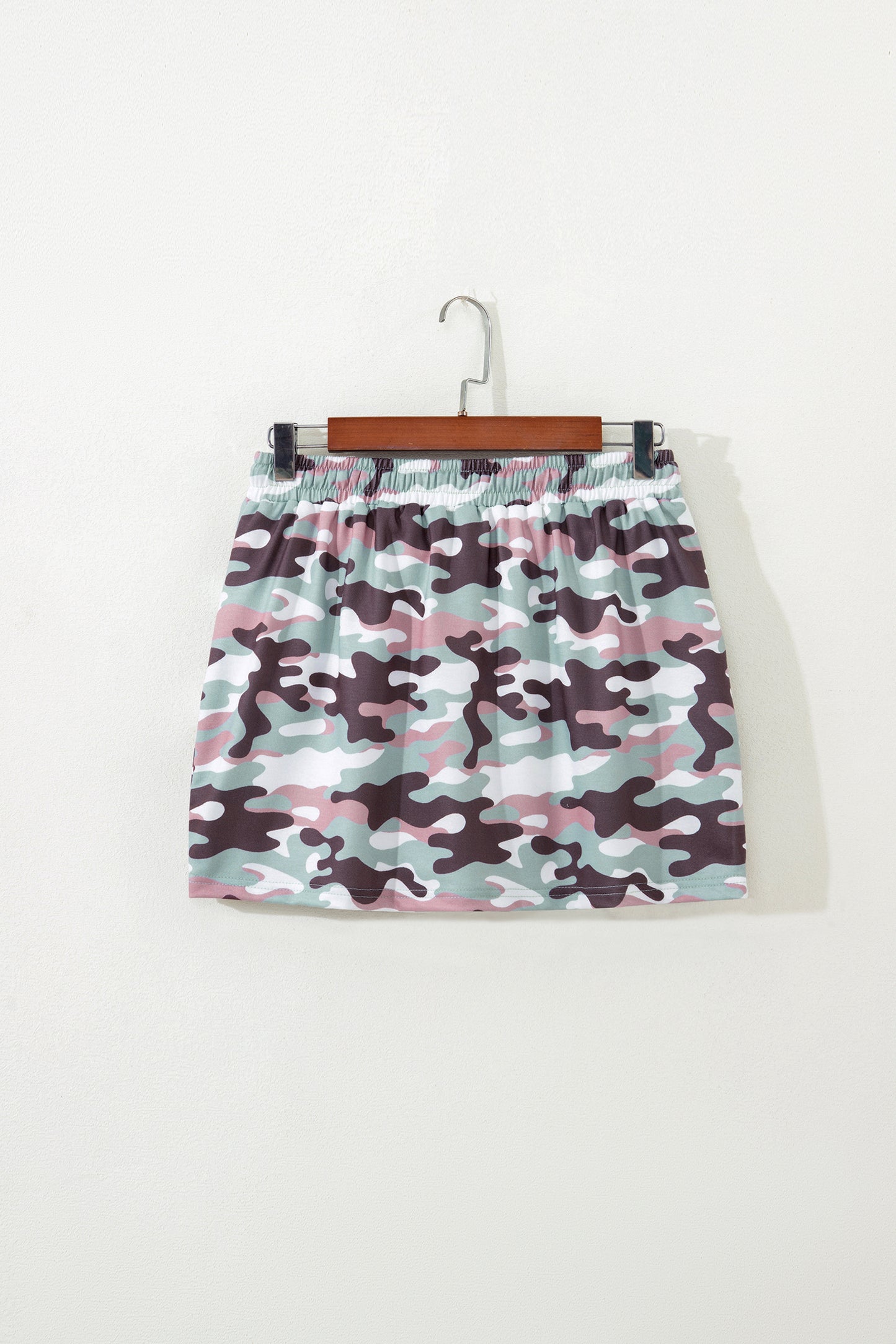 Green camouflage mini skort back view on hanger