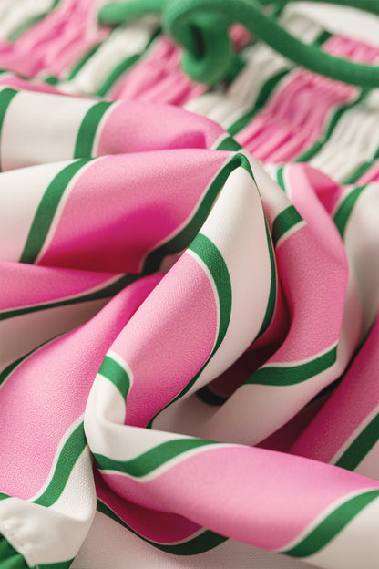 Pink stripe ruffle trim shorts - close-up of side pocket with phone showing pocket depth