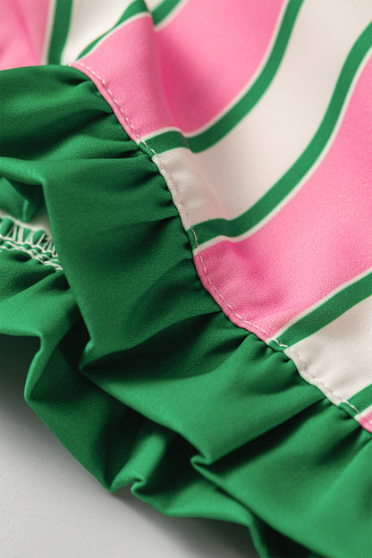 Pink stripe ruffle trim shorts - front on model with pink top showing smocked waistband and green drawstring