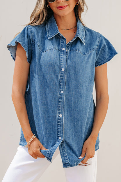 Dusk blue ruffle sleeve denim shirt - front on model with white jeans showing tucked styling