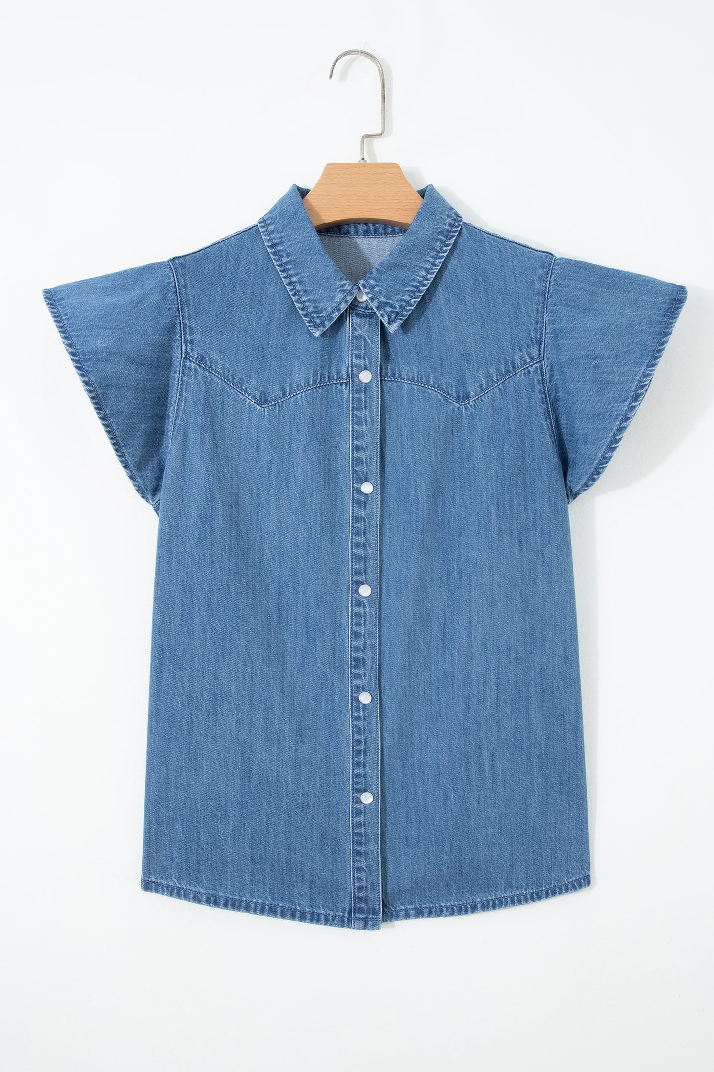 Dusk blue ruffle sleeve denim shirt - front close-up on model showing Western yoke stitching and snap buttons