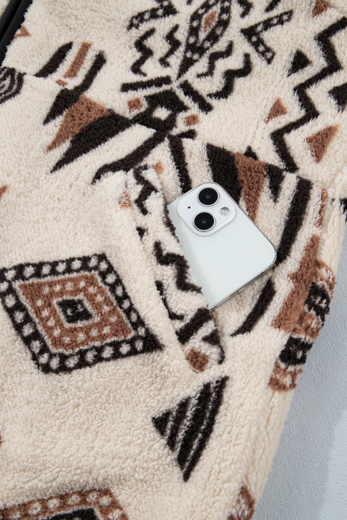 Front view of beige geometric zip-up jacket