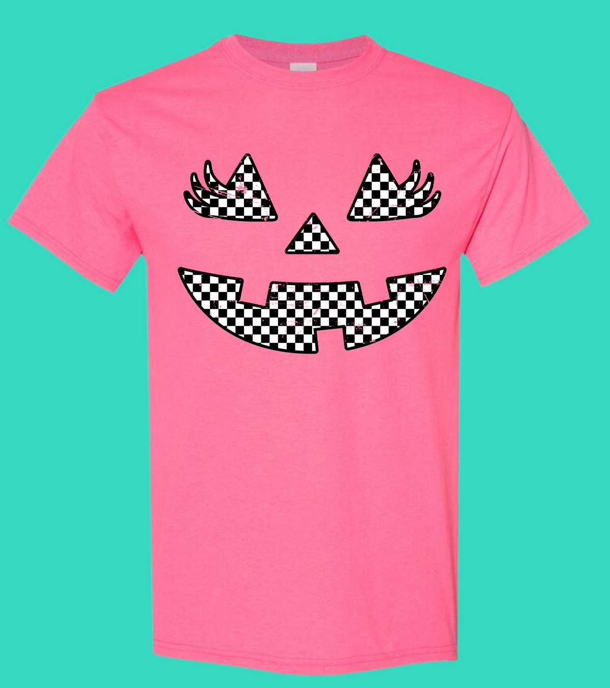 Pink graphic tee with a black-and-white checkerboard smile design