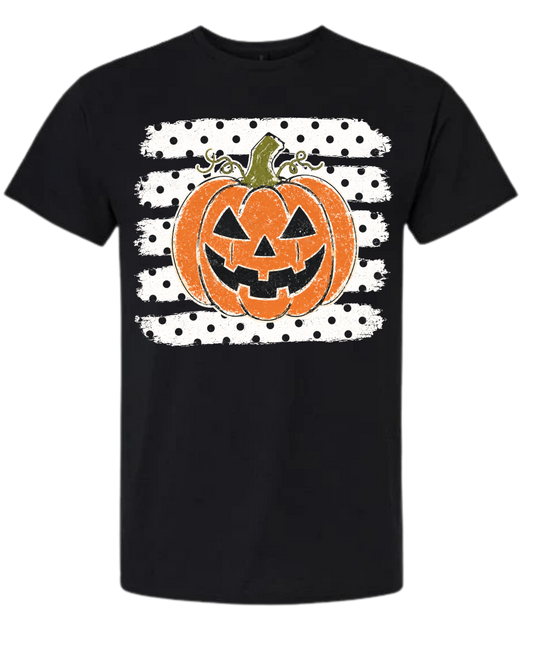 Jack-o'-Lantern Polka Dot Halloween graphic tee in black with distressed orange pumpkin on polka dot brushstroke stripes