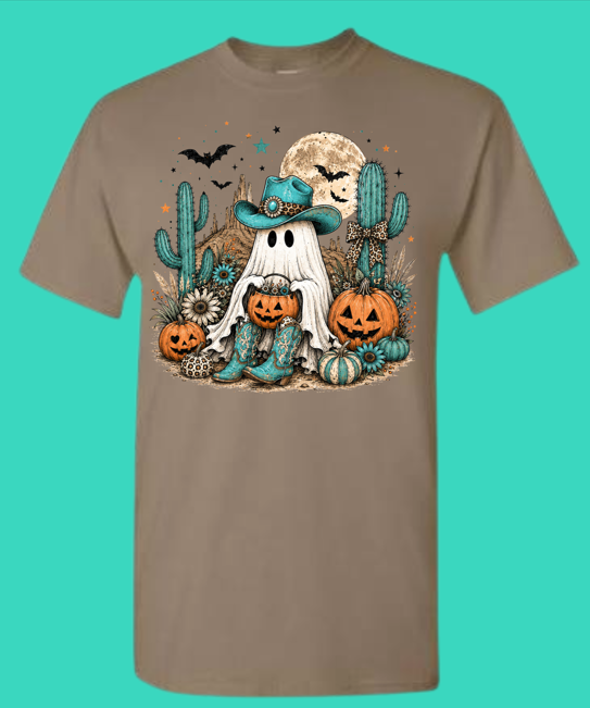 Brown Savana Halloween graphic tee with a cowboy ghost, turquoise hat, pumpkins, cacti, bats, and moon