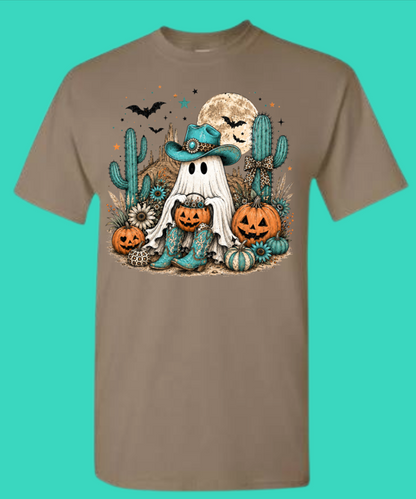Brown Savana Halloween graphic tee with a cowboy ghost, turquoise hat, pumpkins, cacti, bats, and moon