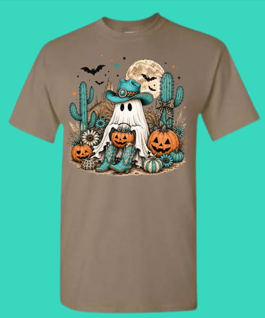 Brown Savana Halloween graphic tee with a cowboy ghost, turquoise hat, pumpkins, cacti, bats, and moon